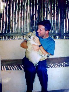 Cuddling the lion cub